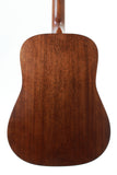 Close-up of a wooden acoustic guitar body on a white background