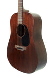 Acoustic guitar with a wooden finish on a white background