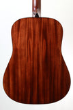 Close-up of a wooden acoustic guitar body on a white background