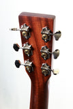 Close-up of a guitar headstock with tuning pegs on a white background
