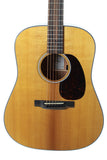 Acoustic guitar with a natural wood finish on a white background
