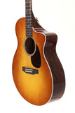 Acoustic guitar with a sunburst finish on a white background