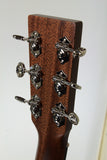 Close-up of a guitar headstock with tuning pegs on a white background