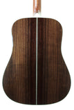Back view of a wooden acoustic guitar on a white background