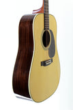 Acoustic guitar with a wooden finish on a white background